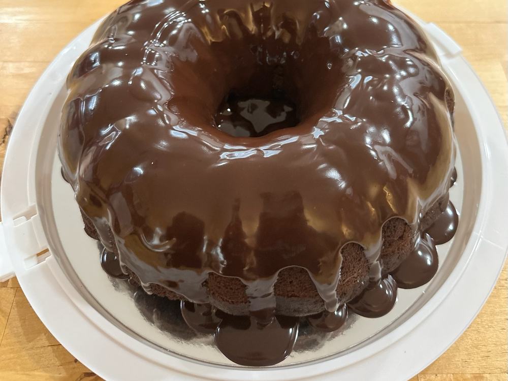 A bundt cake covered in chocolate ganache