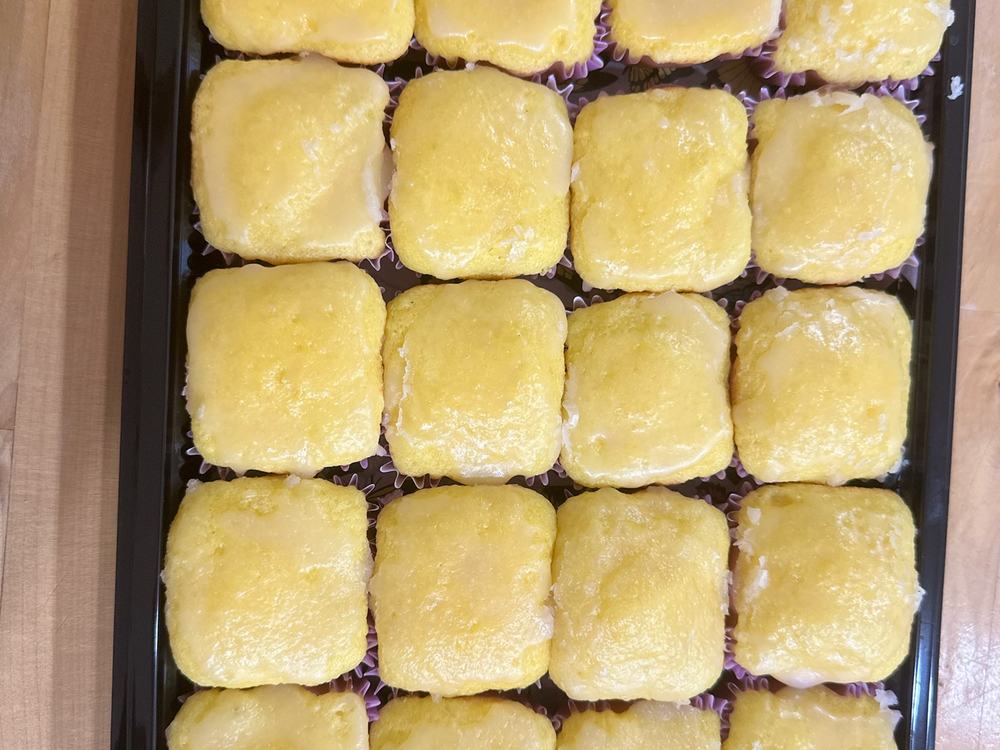 A tray of glazed mini bundt cakes