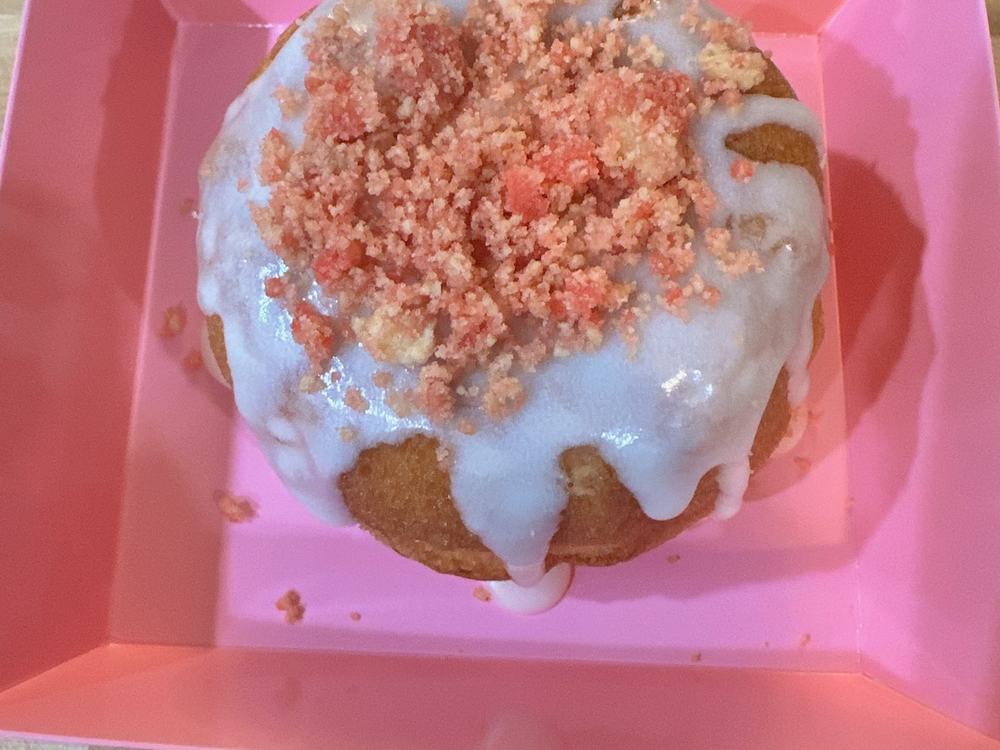 A strawberry crunch bundt cake with icing
