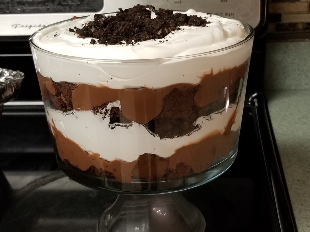 A large chocolate trifle in a glass bowl