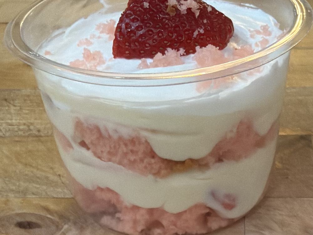A strawberry trifle layered with cake and cream