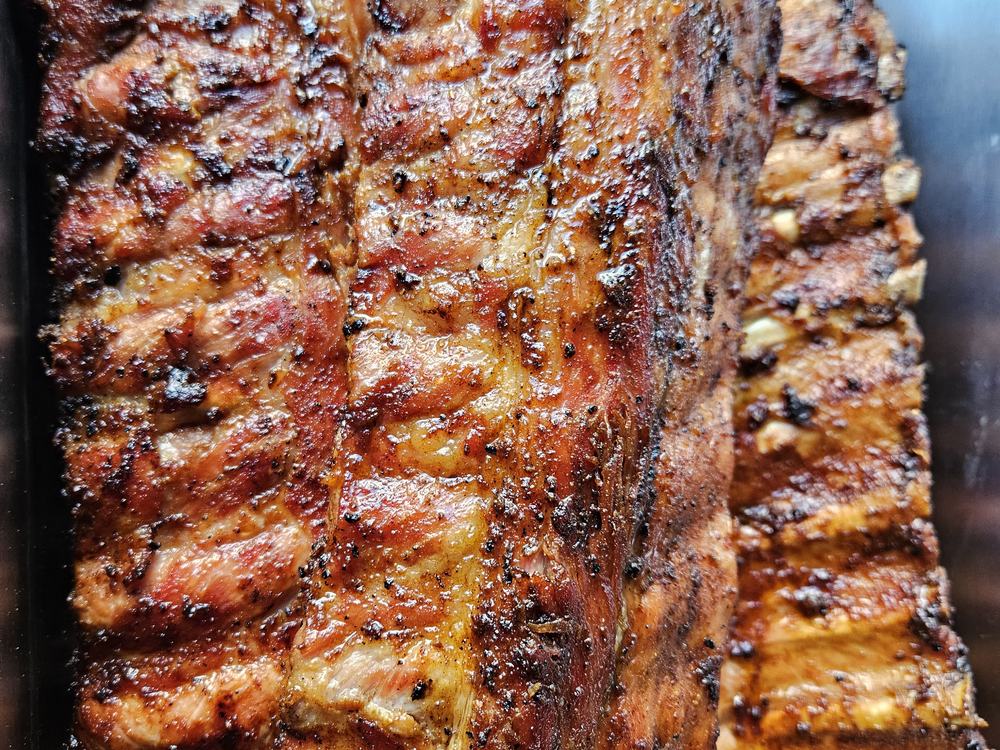 Racks of barbecue ribs off the smoker