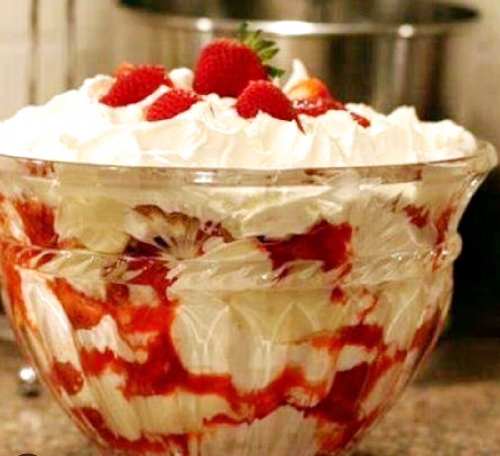 Layered strawberry trifle topped with whipped cream